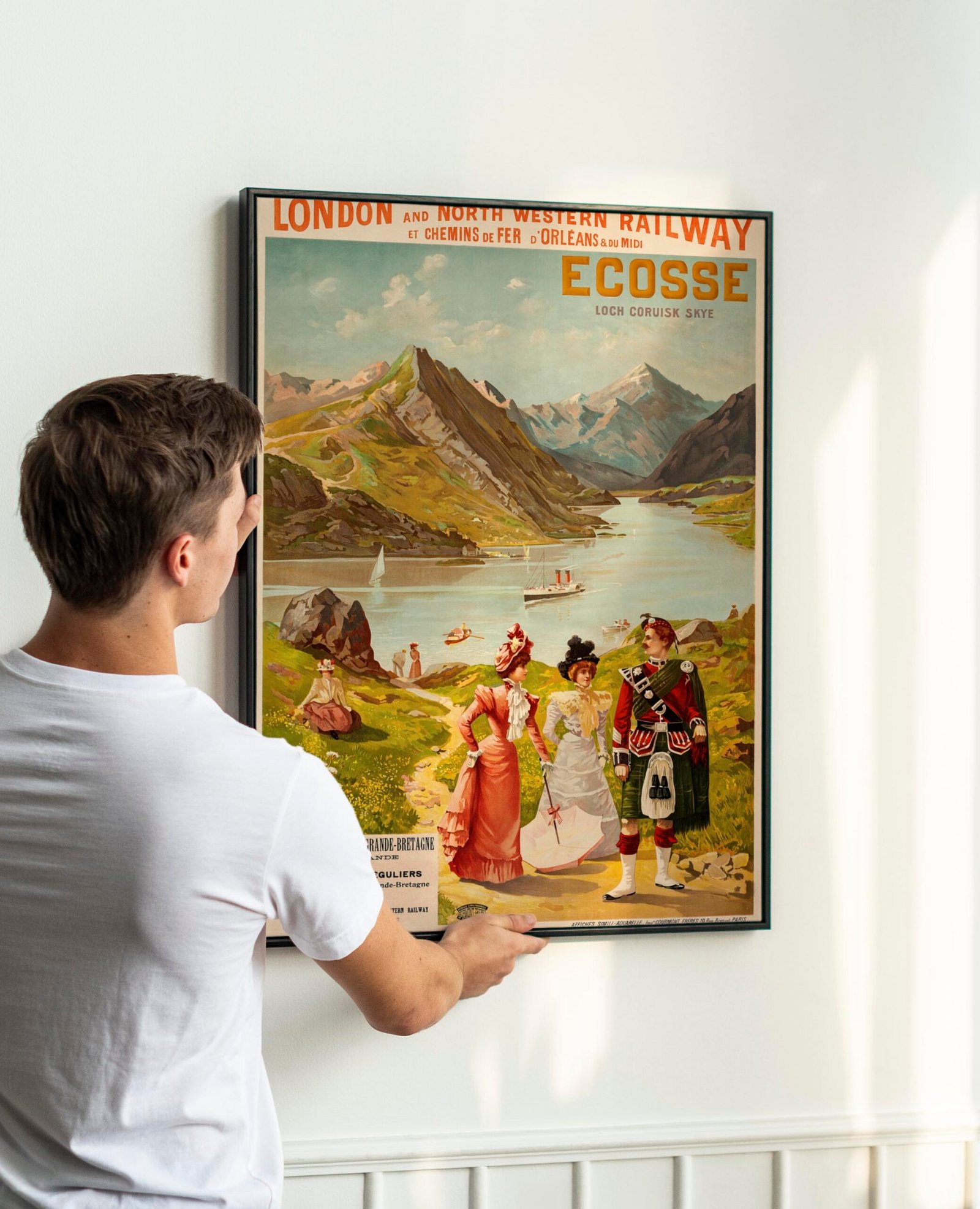 Vintage leaf painting frame psd being hung by a young man on a w