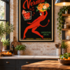 Vintage Italian cocktail poster with a glamorous red devil-like woman, oranges and a vermouth glass on a black background, displayed in a black frame on a loft brick wall.